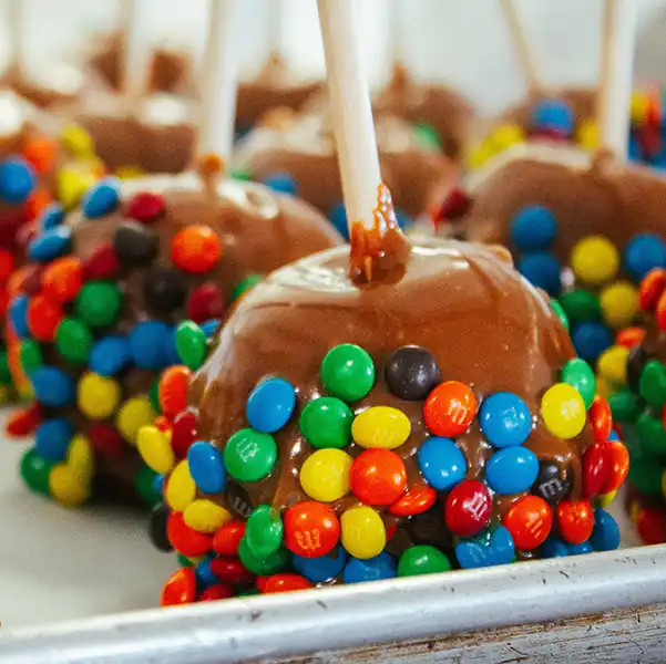 caramel apples coated with M+Ms