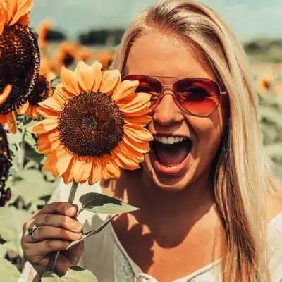 girl holding sunflower